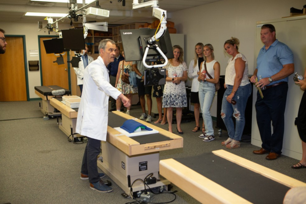 Dr. Degenhardt in the lab giving an OMM demonstration to visitors