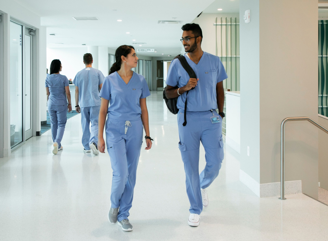 student doctors walking down hall