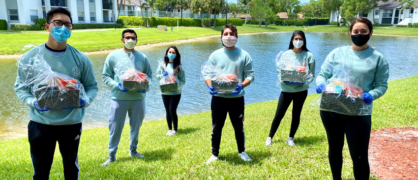 KPCOM COVID-19 group holding PPE packages