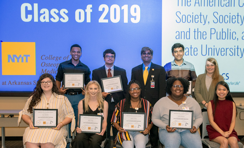 SHARE program participants holding certificates of completion
