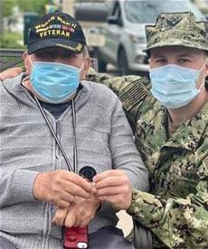 CCOM graduate receives MWU coin from his grandfather, a WWII veteran