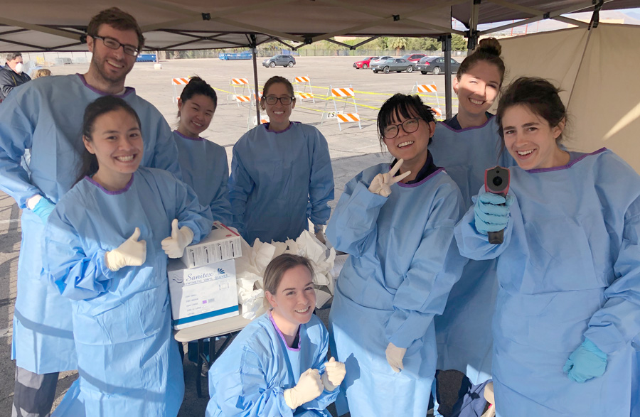 TUNCOM students assist with COVID-19 testing TUNCOM students in protective gowns assist with COVID-19 testing