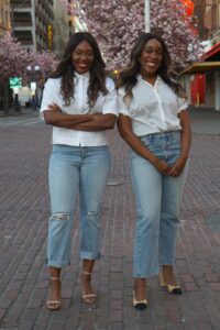 The Egwuatu sisters in white shirts and jeans