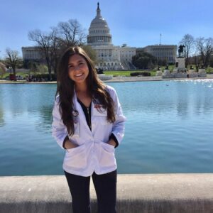 Dr. finger poses by the U.S. Capitol