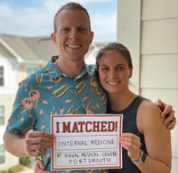 VCOM students hold "I Matched at Naval Medical Center Portsmouth" sign