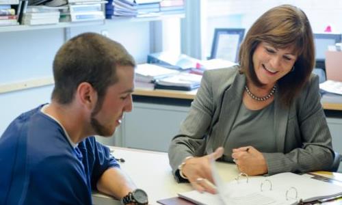 Student reviewing schedule with pre-health advisor