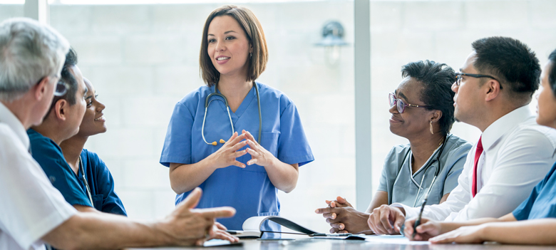 istock-862229772_780px doctor presenting to health providers at a meeting