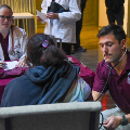 Studentdoctorslistentopatientsheartbeatandtakenotes