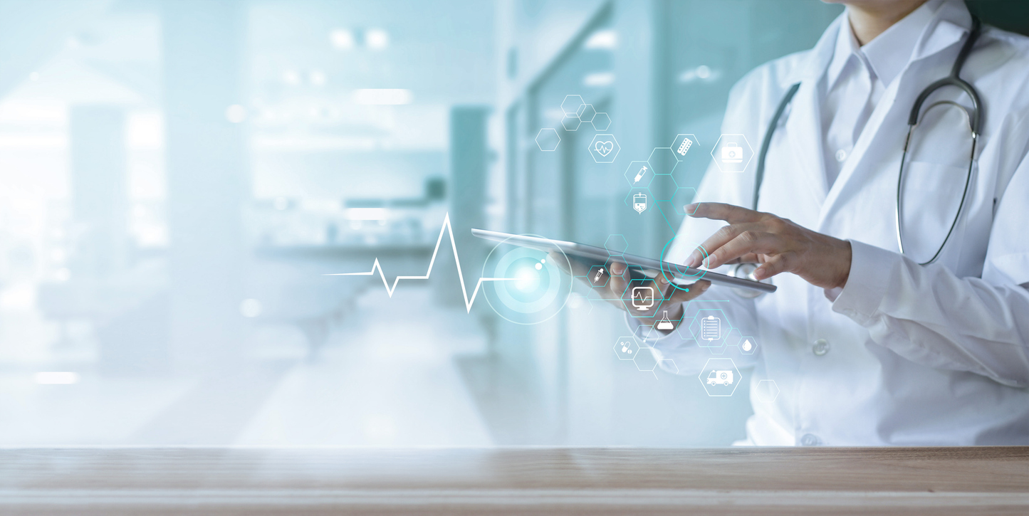 iStock-1182619271 Female doctor in hospital setting scrolling on an iPad
