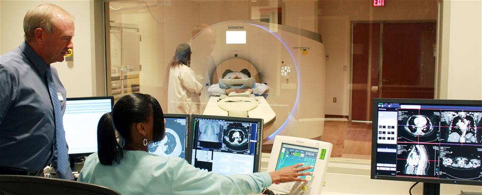NIH CT scanning facilty Medical professionals performing a CT scan on a patient.